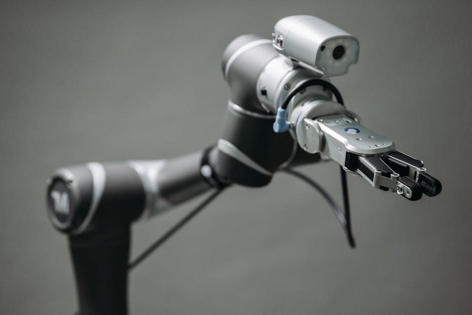Close-up view of a robotic arm equipped with a video camera, showcasing modern technology